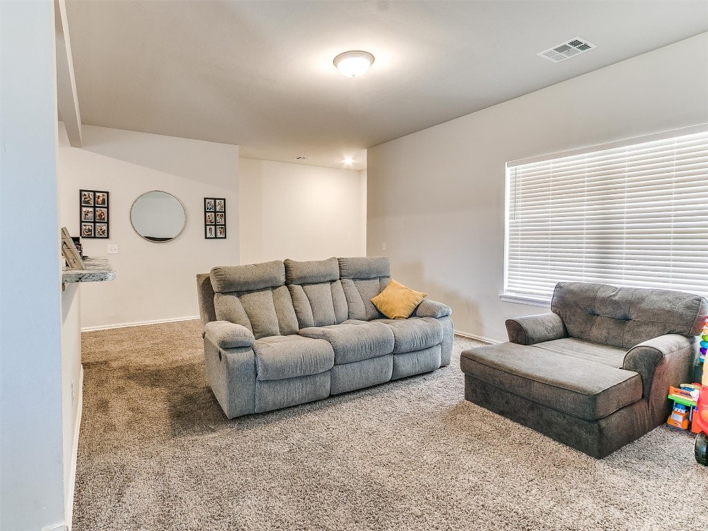 1016 S Appaloosa Lane, Mustang, OK 73064 living room featuring carpet flooring
