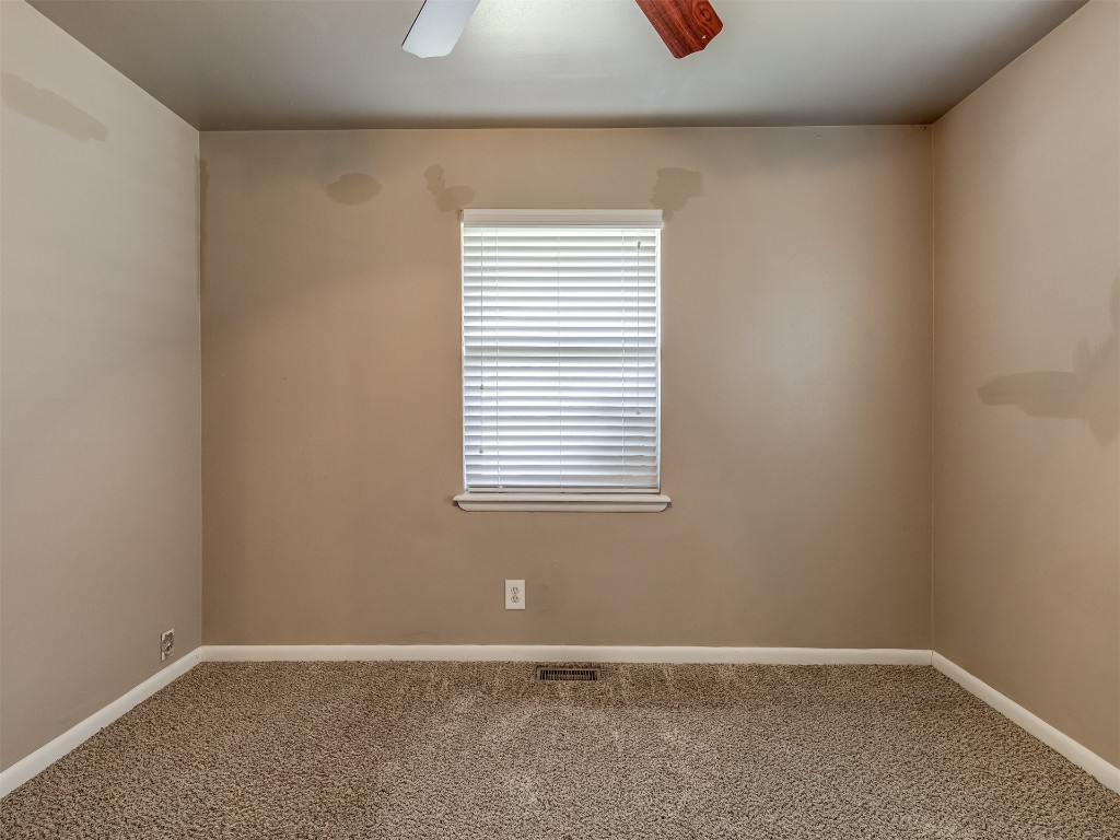 1706 Janeen Street, Yukon, OK 73099 unfurnished room featuring ceiling fan and carpet flooring