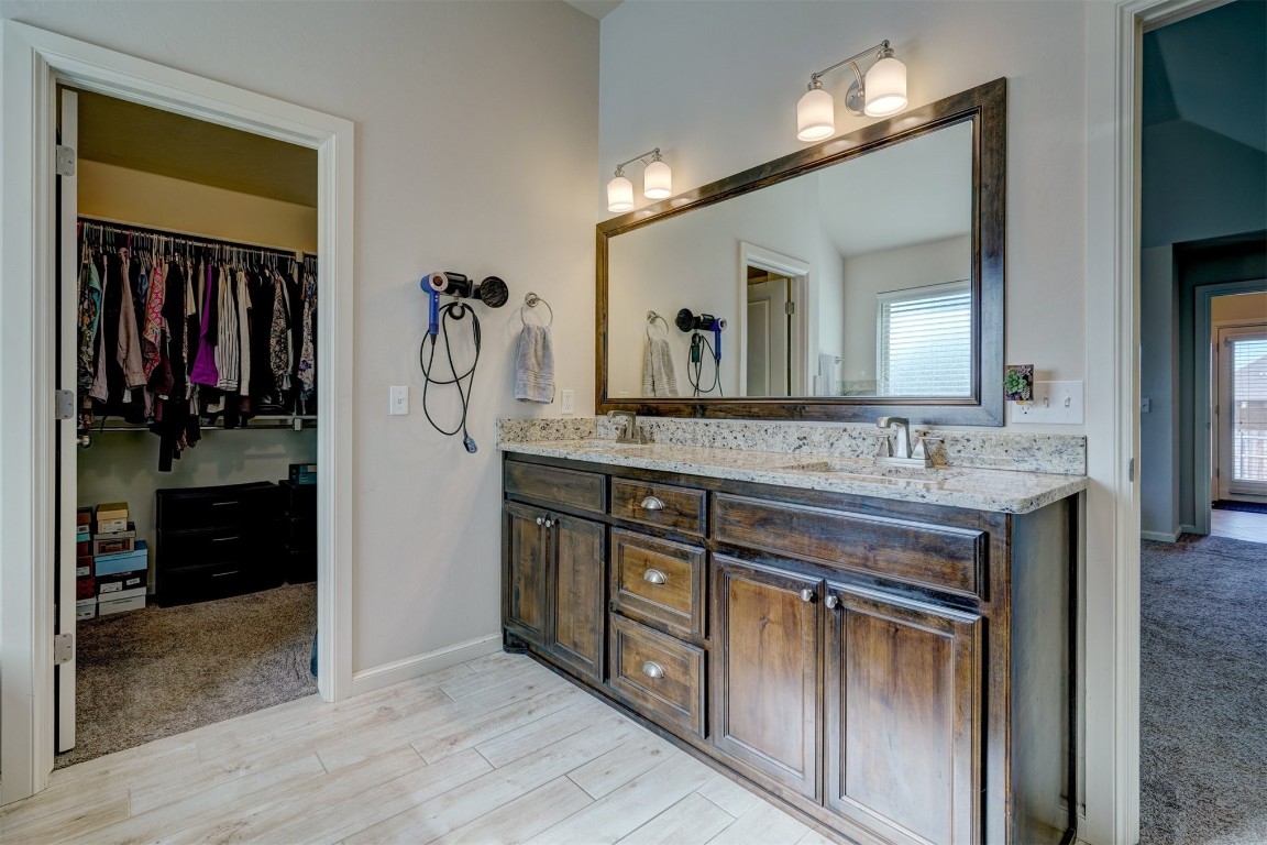 624 NW 188th Street, Edmond, OK 73012 bathroom featuring separate shower and tub and toilet