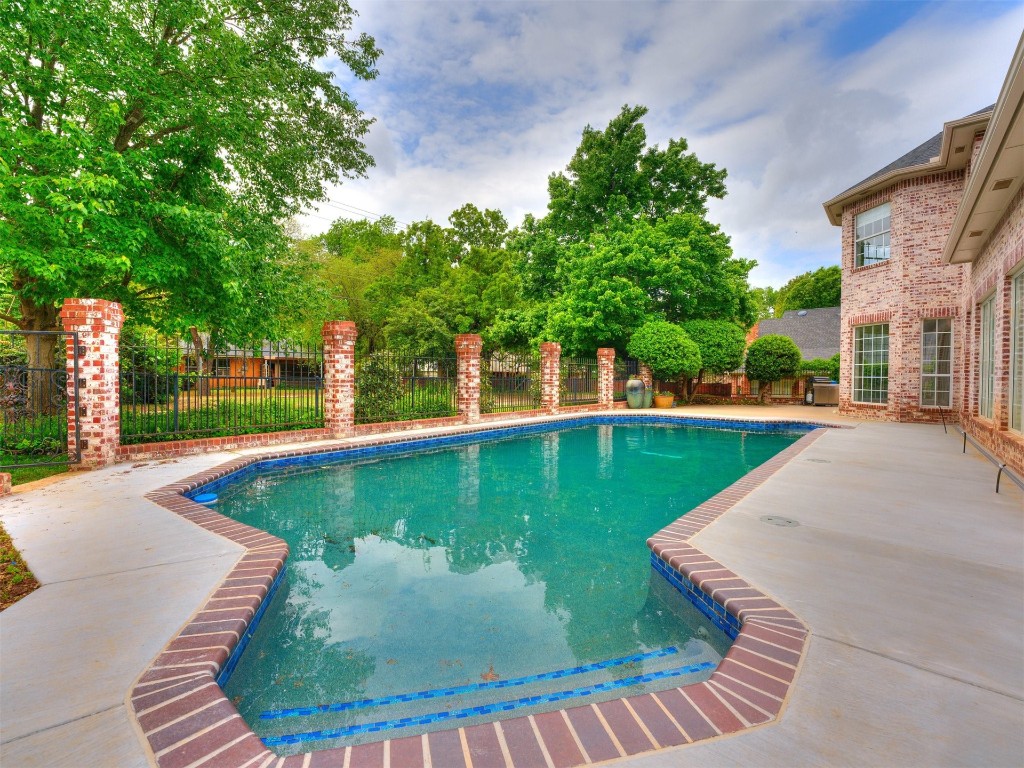 1307 Brookside Drive, Norman, OK 73072 view of swimming pool featuring a patio area