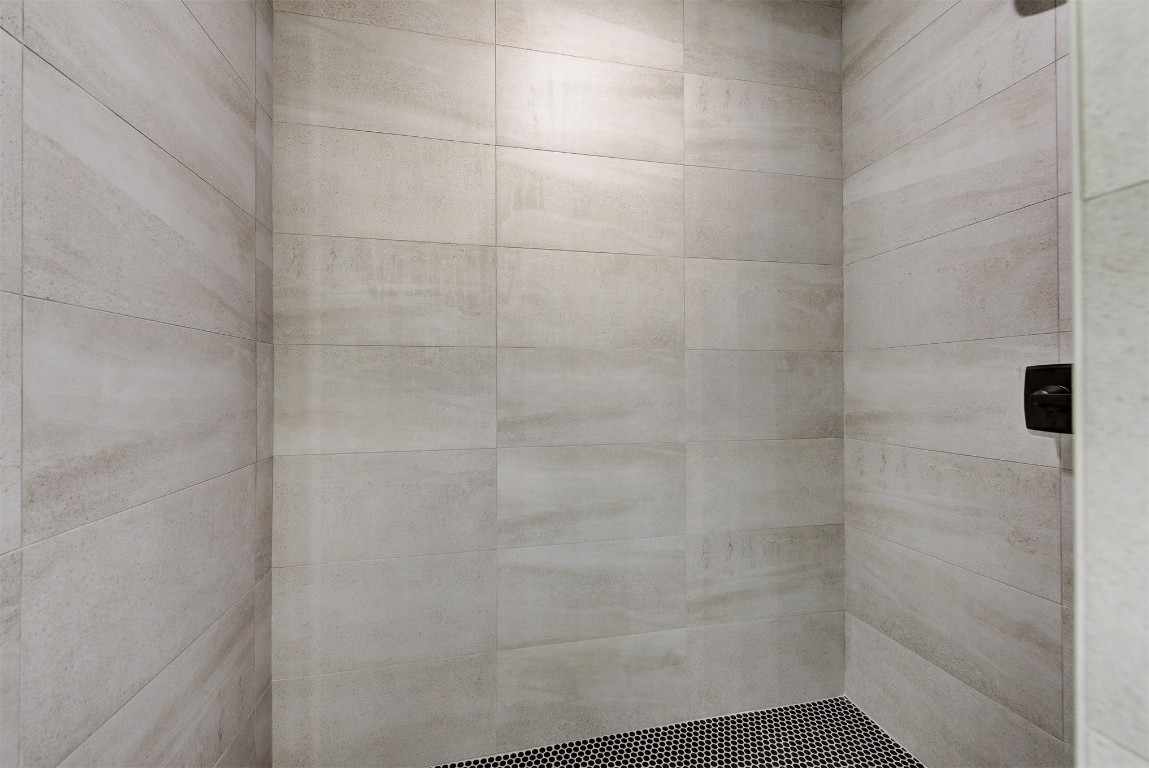 4124 Emery Drive, Edmond, OK 73034 bathroom with a tile shower