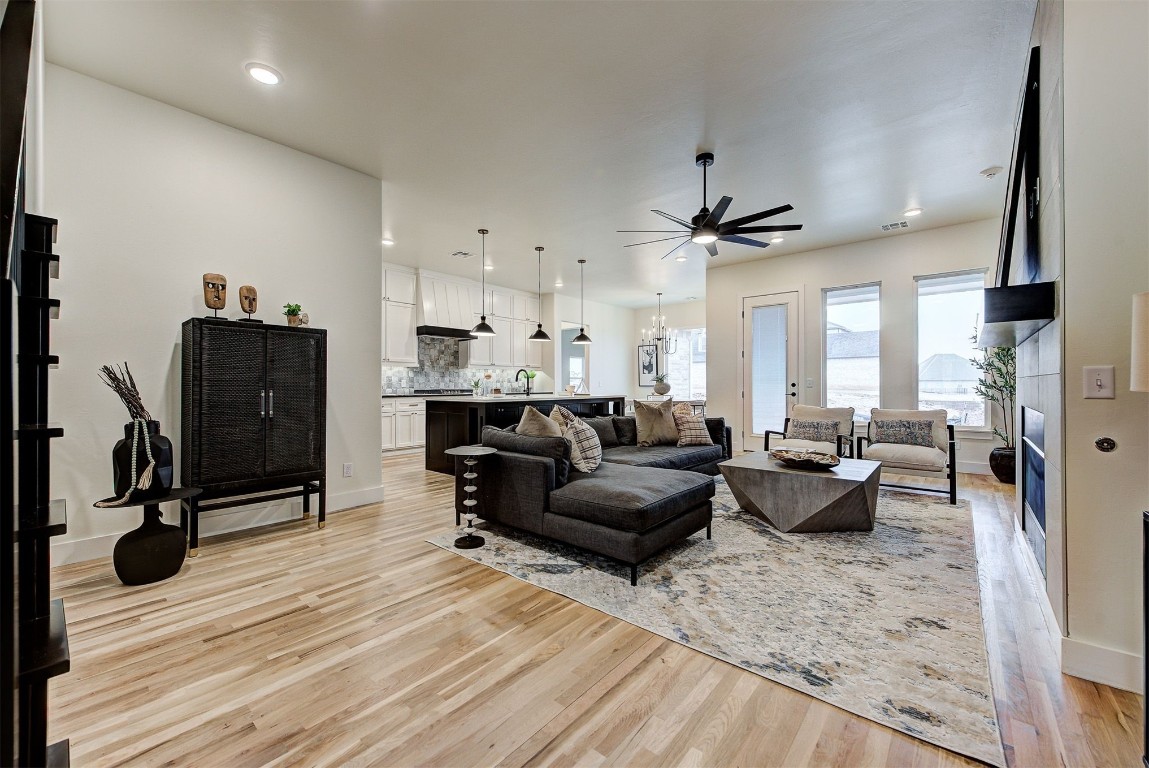 4124 Emery Drive, Edmond, OK 73034 living room with sink, ceiling fan, and light hardwood / wood-style floors