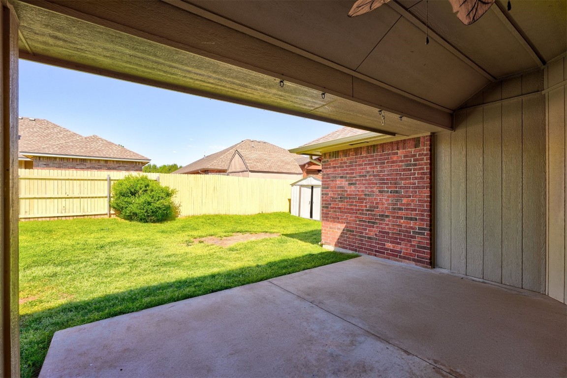 713 N Bobcat Way, Mustang, OK 73064 view of patio with an outdoor structure
