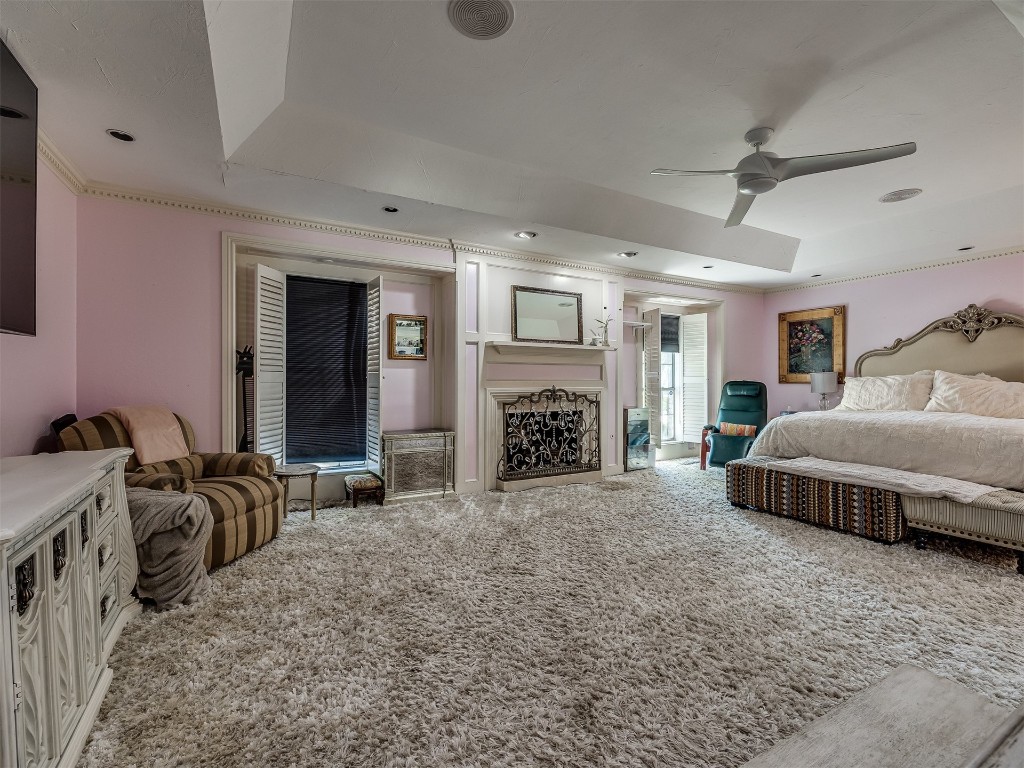 12801 Deerfield Circle, Oklahoma City, OK 73142 carpeted bedroom featuring ceiling fan