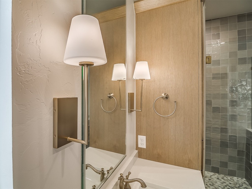 16413 Loire East Drive, Edmond, OK 73013 bathroom featuring a tile shower