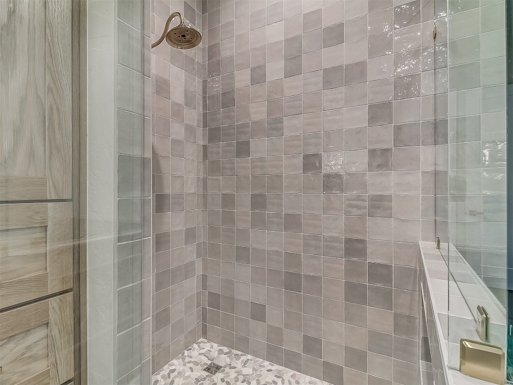 16413 Loire East Drive, Edmond, OK 73013 bathroom featuring tiled shower