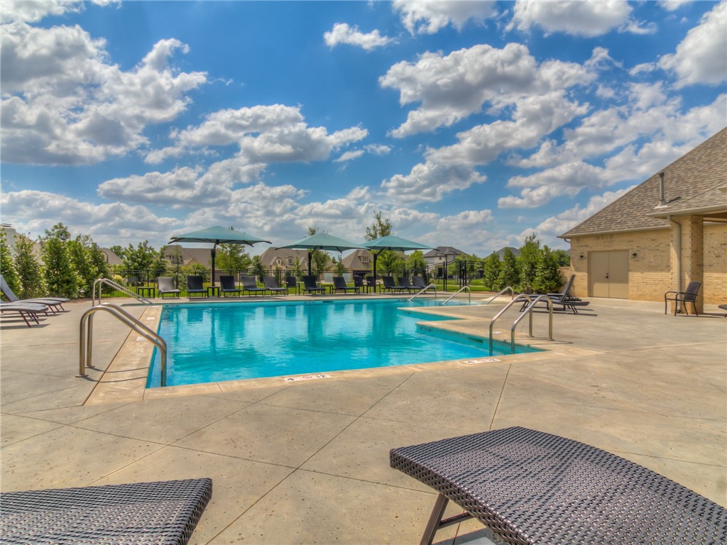 16413 Loire East Drive, Edmond, OK 73013 view of swimming pool with a patio area