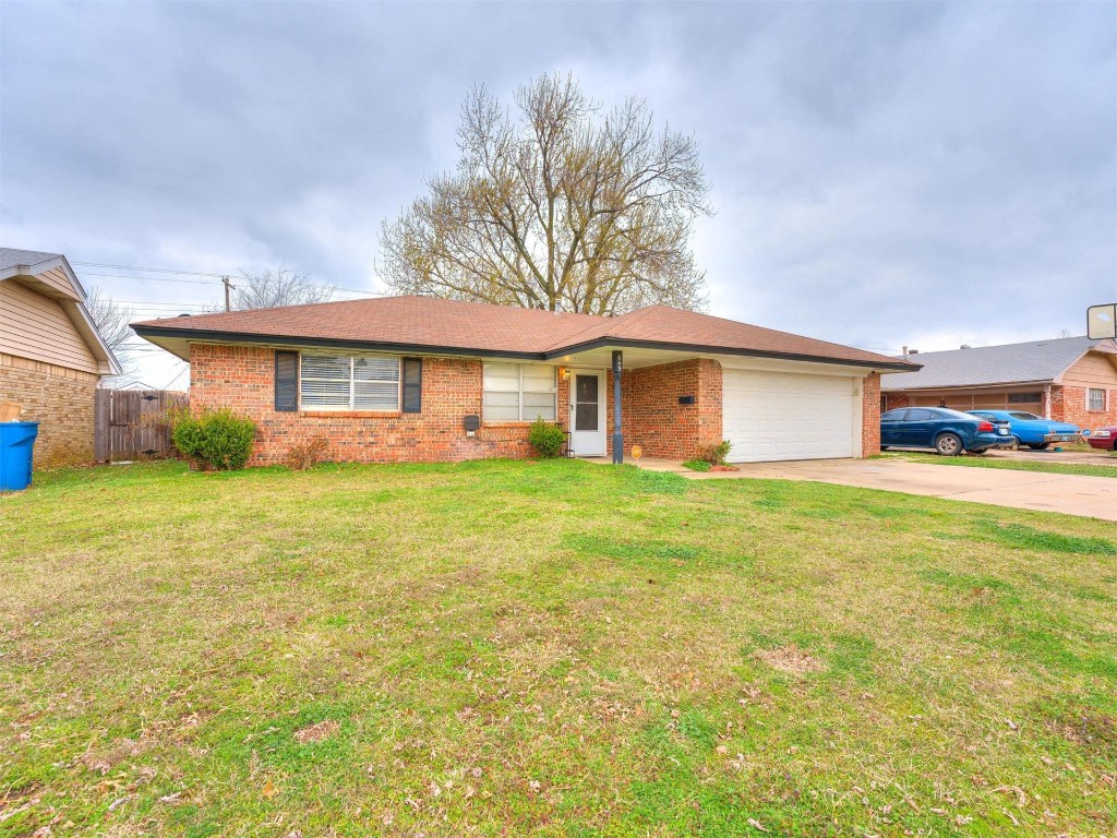 649 Juniper Avenue, Midwest City, OK 73130 single story home with a garage and a front yard