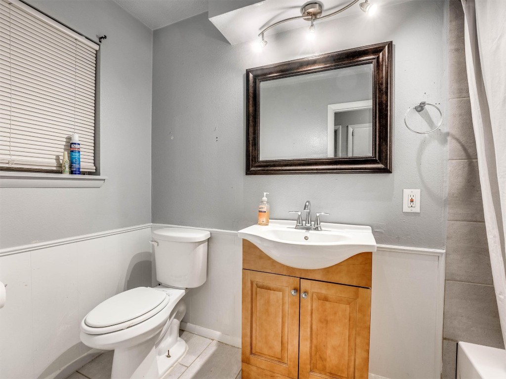 649 Juniper Avenue, Midwest City, OK 73130 bathroom featuring tile flooring, vanity, and toilet
