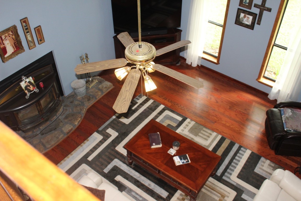 511 Oak Hill, Broken Bow, OK 74728 living room featuring wood-type flooring and ceiling fan