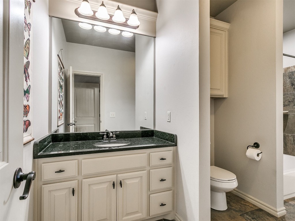 917 NW 195th Place, Edmond, OK 73012 bathroom featuring toilet and vanity
