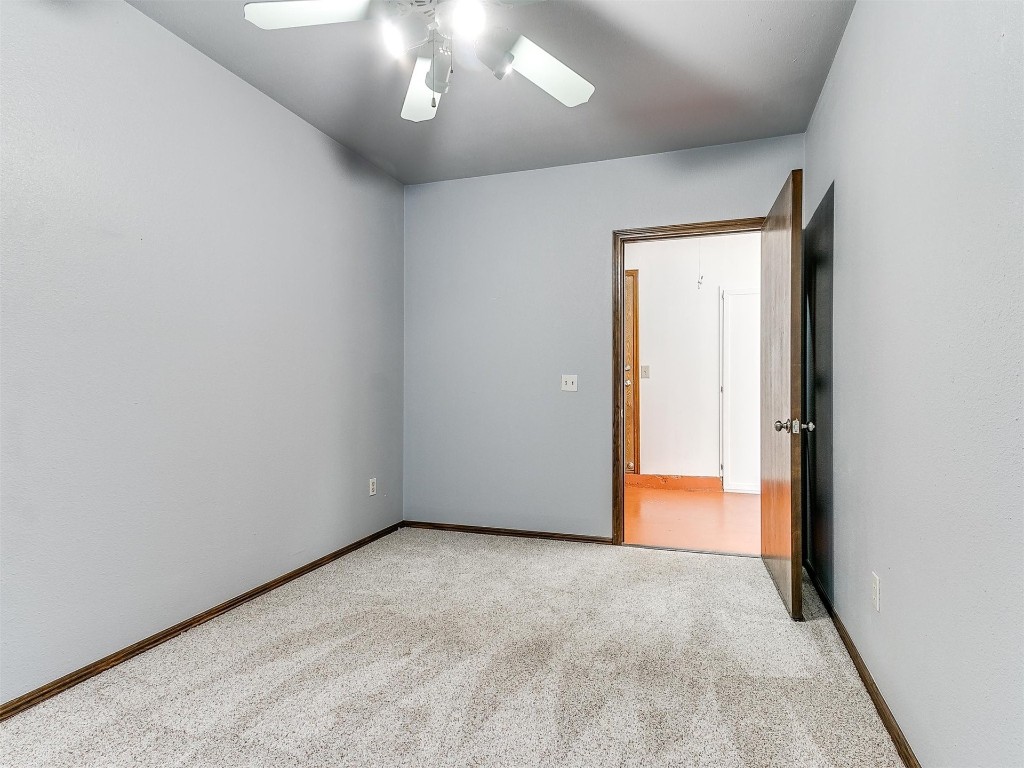 3908 Corbett Drive, Del City, OK 73115 unfurnished room with ceiling fan and carpet floors