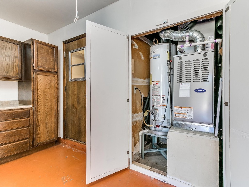 3908 Corbett Drive, Del City, OK 73115 utility room featuring water heater
