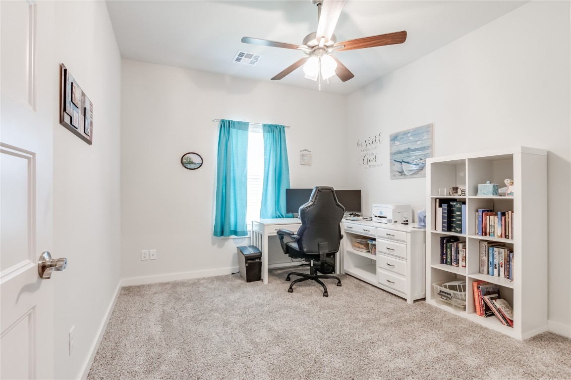 11636 NW 109th Street, Yukon, OK 73099 home office featuring ceiling fan and light carpet