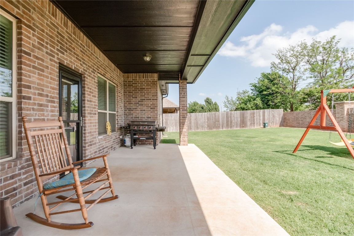 11636 NW 109th Street, Yukon, OK 73099 view of patio / terrace featuring a playground and grilling area