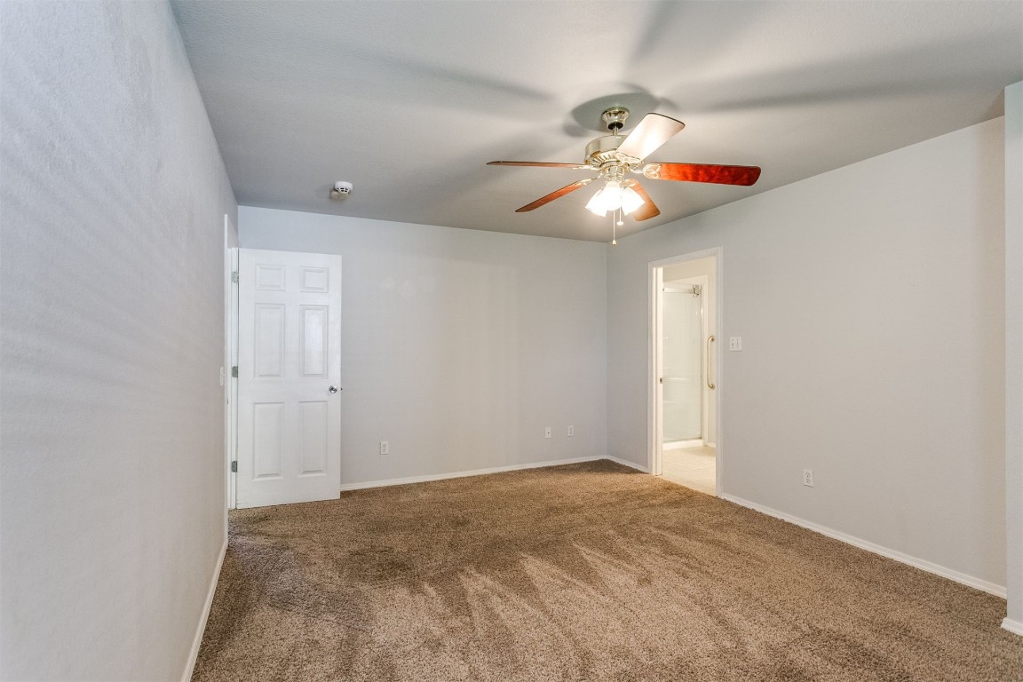 949 NW 15th Street, Moore, OK 73160 carpeted empty room featuring ceiling fan