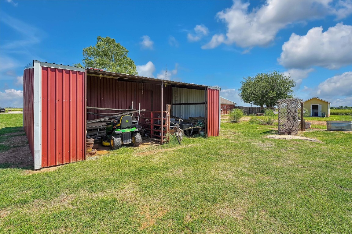 20290 E County Road 175, Elmer, OK 73539 view of outdoor structure featuring a yard
