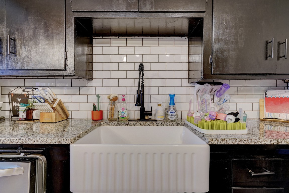 1012 S Williams Avenue, El Reno, OK 73036 kitchen with sink and tasteful backsplash