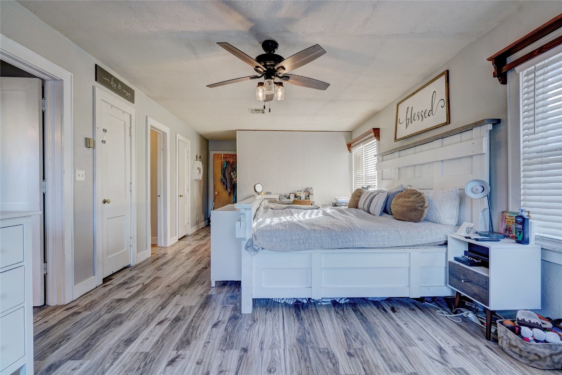 1012 S Williams Avenue, El Reno, OK 73036 bedroom with ceiling fan and hardwood / wood-style flooring