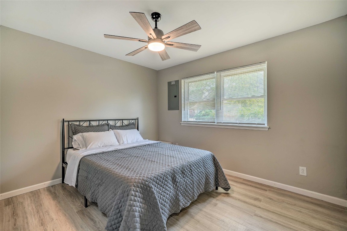 1309 Keystone Lane, Norman, OK 73071 bedroom with ceiling fan and light wood-type flooring