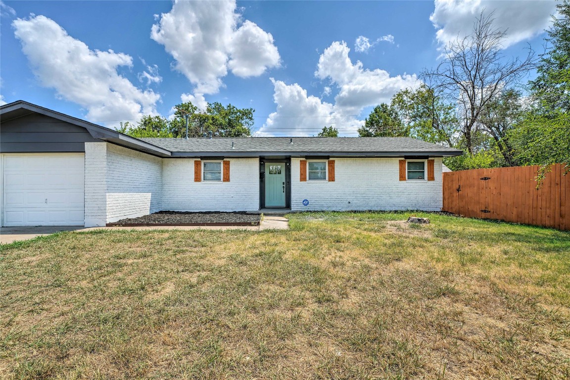 1309 Keystone Lane, Norman, OK 73071 ranch-style house with a garage and a front yard
