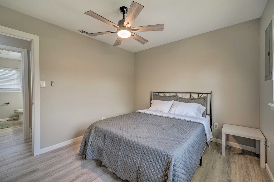 1309 Keystone Lane, Norman, OK 73071 bedroom featuring light hardwood / wood-style floors and ceiling fan