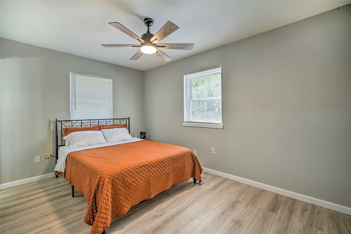 1309 Keystone Lane, Norman, OK 73071 bedroom featuring light hardwood / wood-style floors and ceiling fan