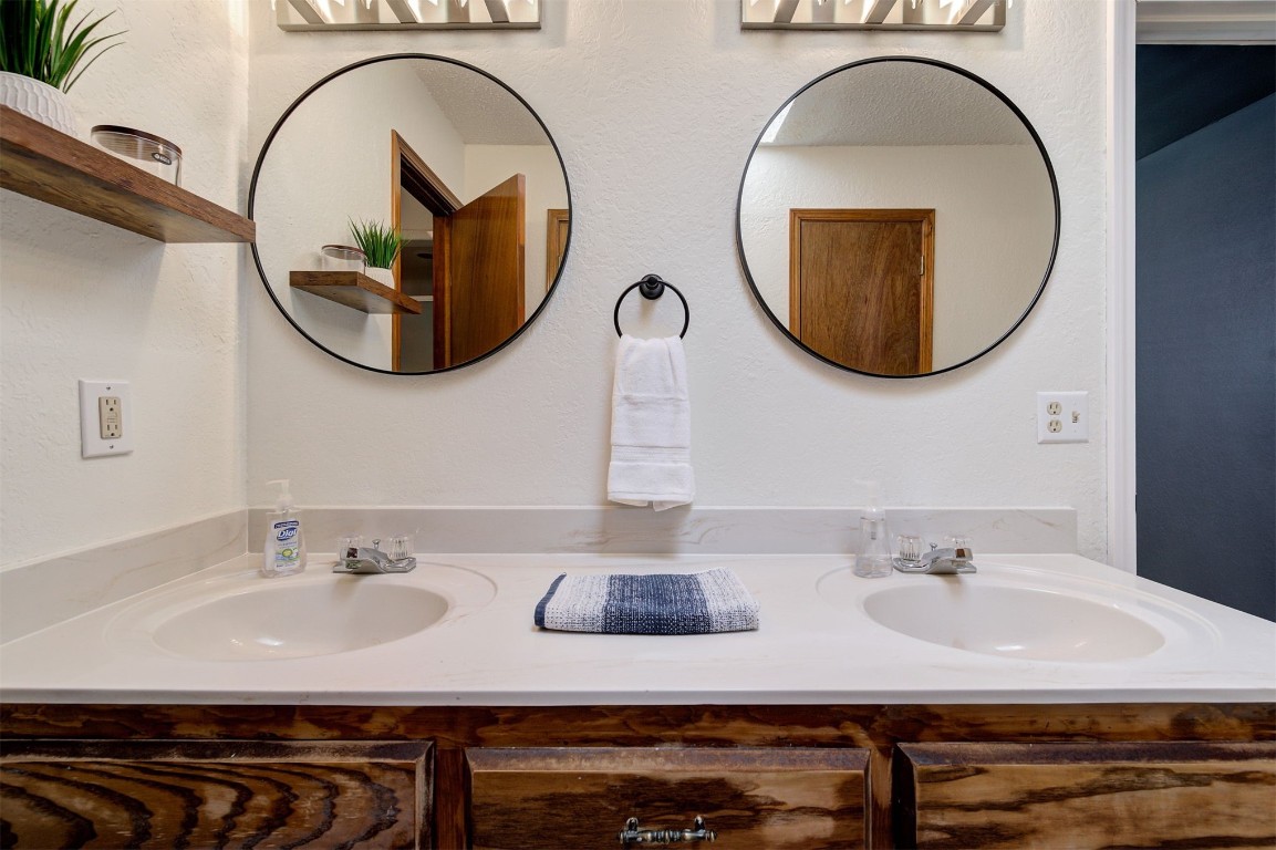 16905 Valley Lane, Edmond, OK 73012 bathroom featuring dual vanity