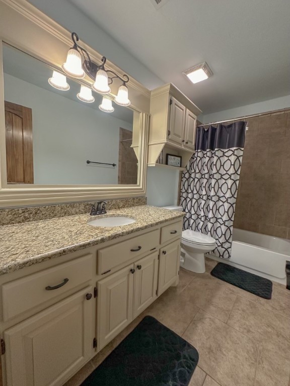 9116 NW 140th Street, Yukon, OK 73099 full bathroom featuring tile floors, shower / tub combo, vanity, and toilet