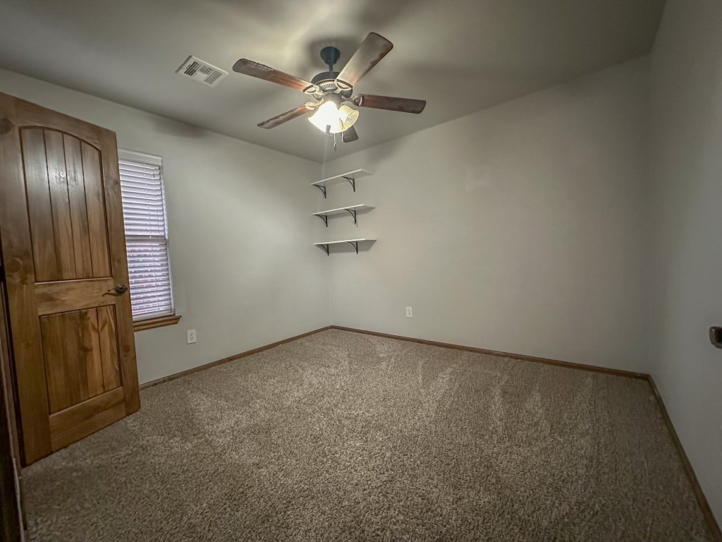 9116 NW 140th Street, Yukon, OK 73099 carpeted empty room featuring ceiling fan