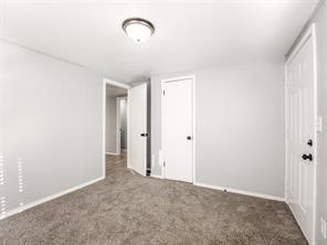 3945 NW 12th Street, Oklahoma City, OK 73107 unfurnished bedroom featuring carpet