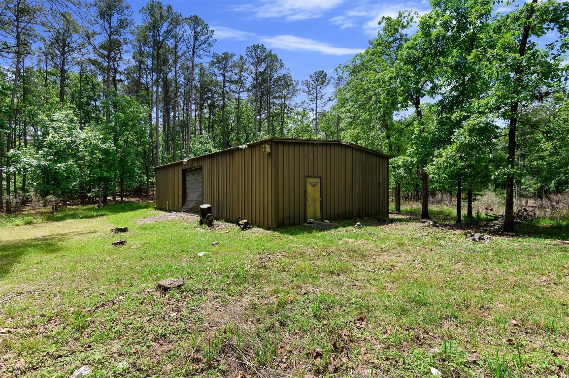 688 Old Hochatown Road, Broken Bow, OK 74728 view of yard with a garage and an outdoor structure