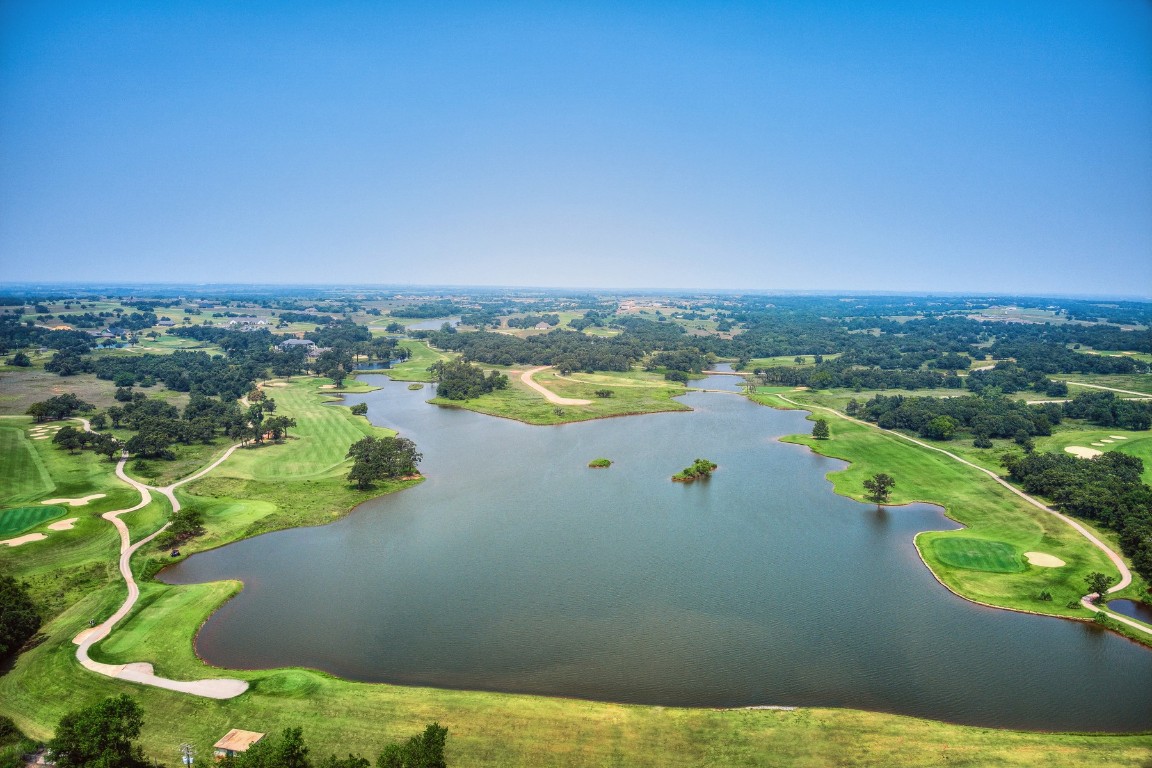 2371 Clubhouse Drive, Blanchard, OK 73010 aerial view with a water view