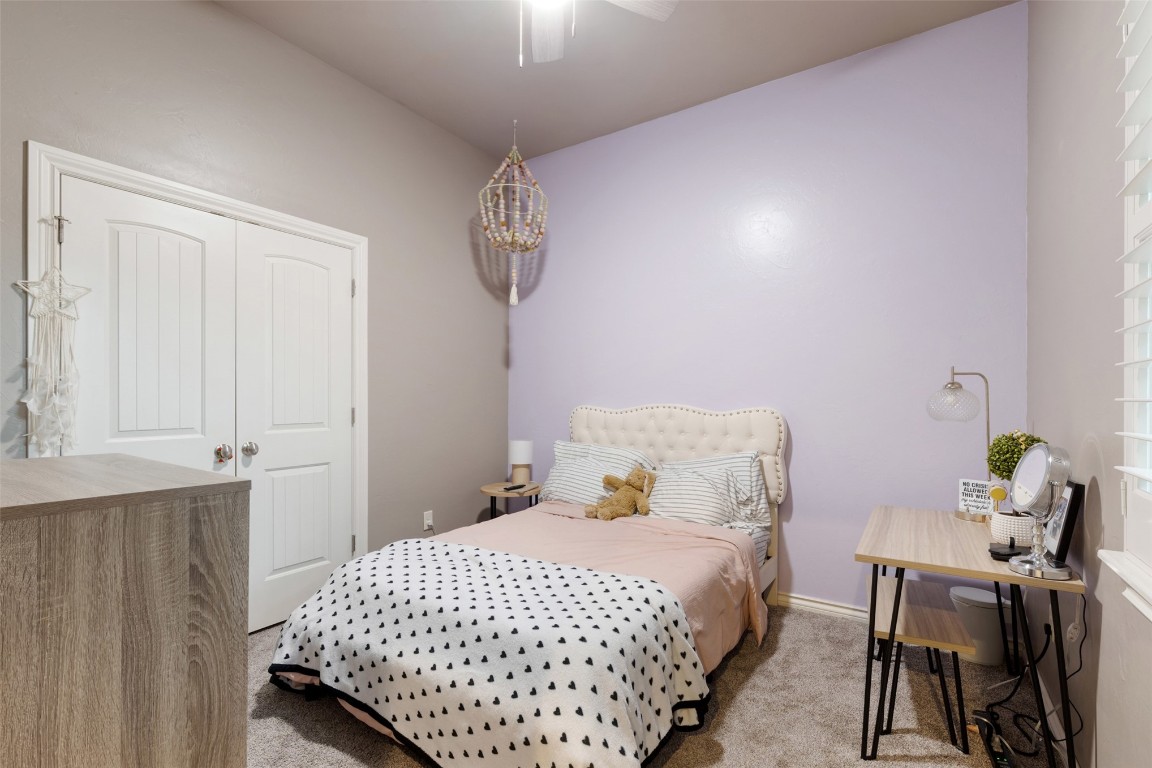 3501 Dornoch Drive, Edmond, OK 73034 bedroom featuring a closet, ceiling fan, and carpet floors