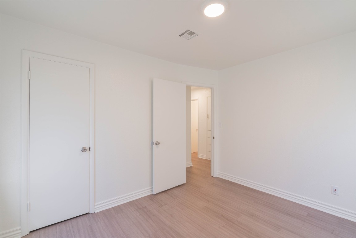 2420 SW 50th Street, Oklahoma City, OK 73119 unfurnished bedroom featuring light hardwood / wood-style flooring