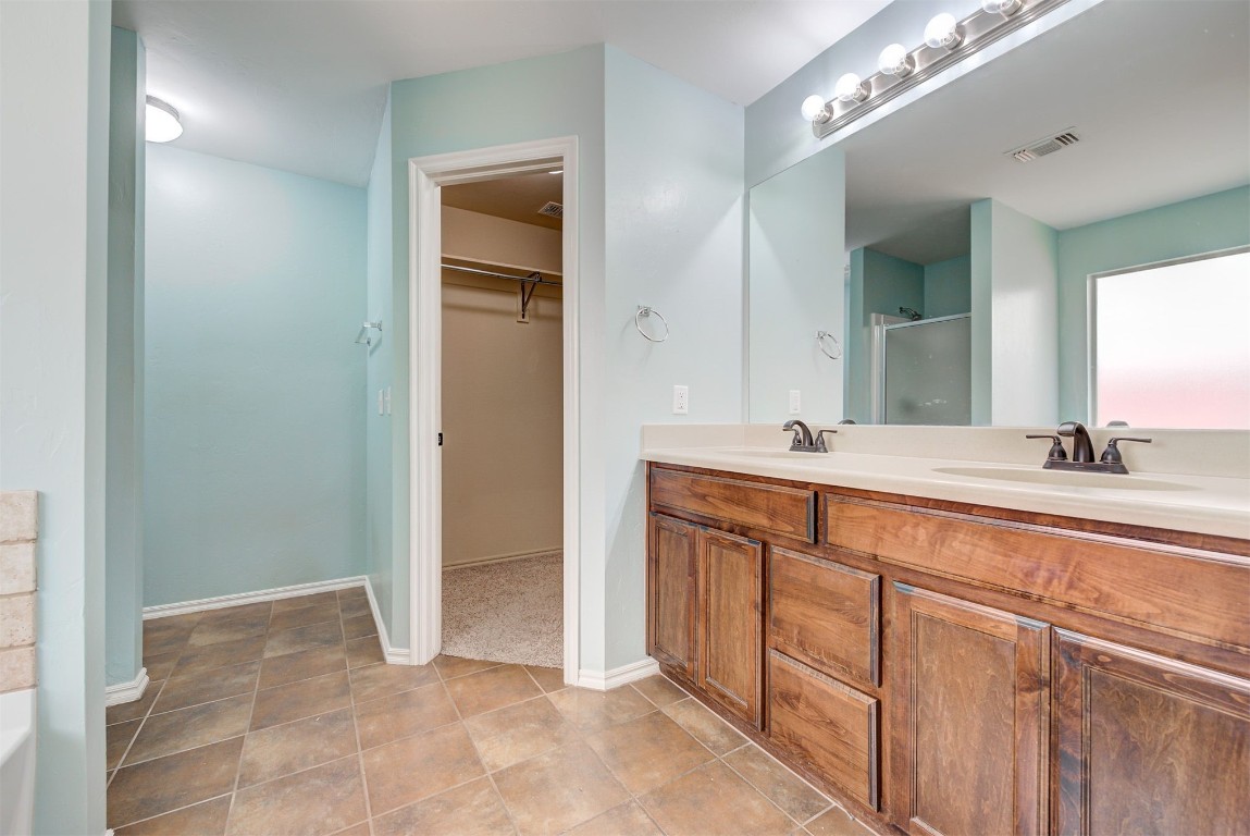 3508 Frederick Drive, Norman, OK 73071 bathroom featuring tile flooring, large vanity, and dual sinks