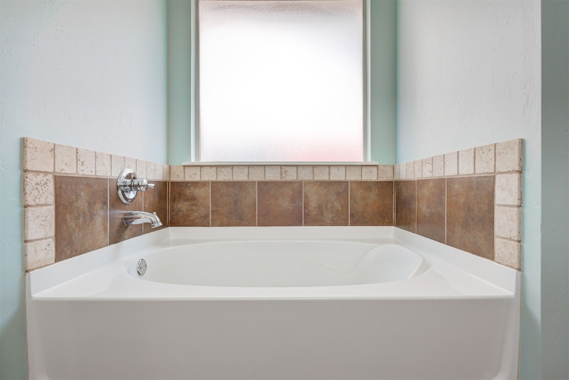 3508 Frederick Drive, Norman, OK 73071 bathroom with a washtub