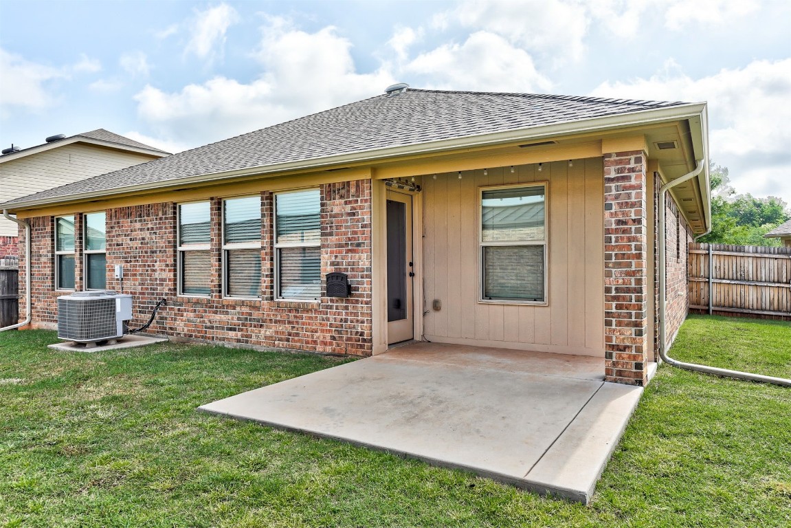 3508 Frederick Drive, Norman, OK 73071 back of house with a yard, central air condition unit, and a patio area