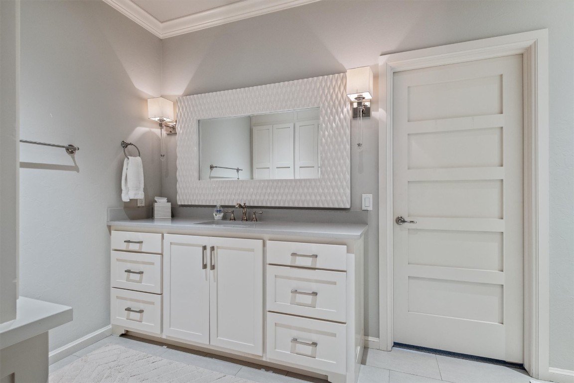 1200 Marlboro Lane, Nichols Hills, OK 73116 bathroom featuring ornamental molding, tile floors, and vanity