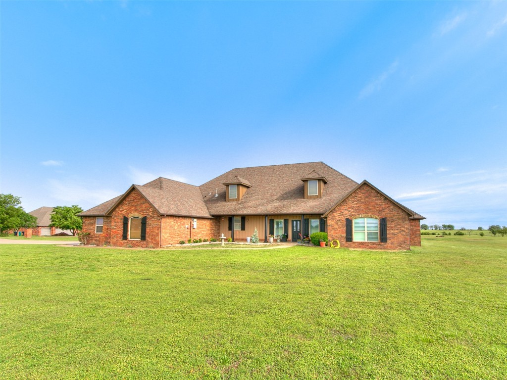 2900 Big Sky Circle, Yukon, OK 73099 new england style home featuring a front lawn