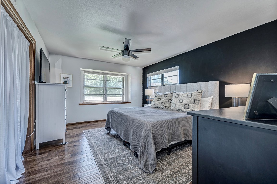 5213 N Miller Place, Oklahoma City, OK 73112 bedroom featuring dark hardwood / wood-style flooring and ceiling fan