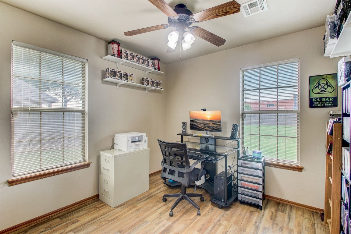 1306 SW 25th Street, Moore, OK 73170 home office with a wealth of natural light, light hardwood / wood-style floors, and ceiling fan