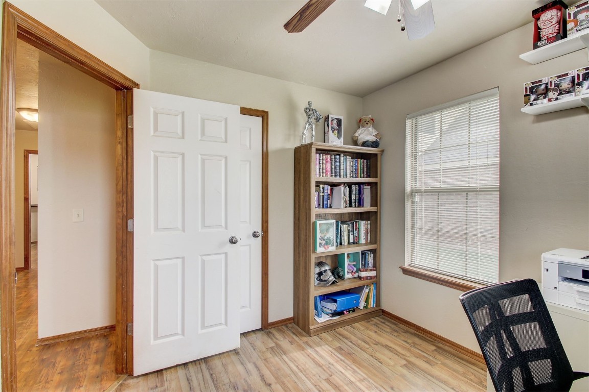 1306 SW 25th Street, Moore, OK 73170 home office featuring ceiling fan and light hardwood / wood-style floors