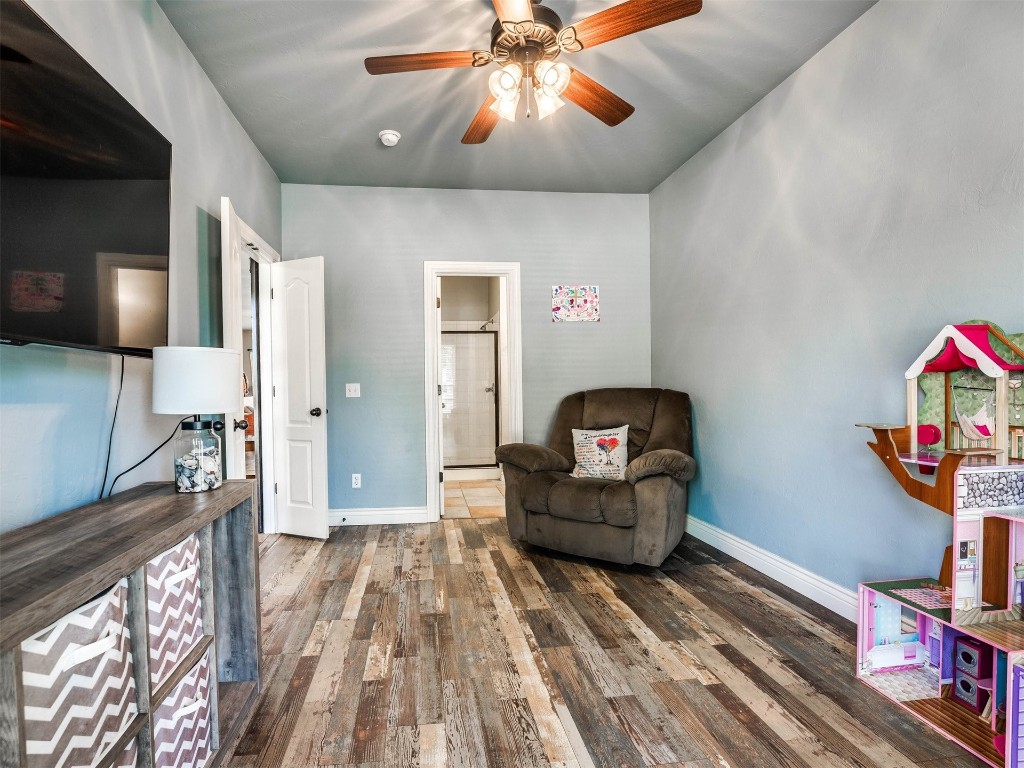 5112 SW 123rd Street, Oklahoma City, OK 73173 sitting room featuring dark hardwood / wood-style flooring and ceiling fan