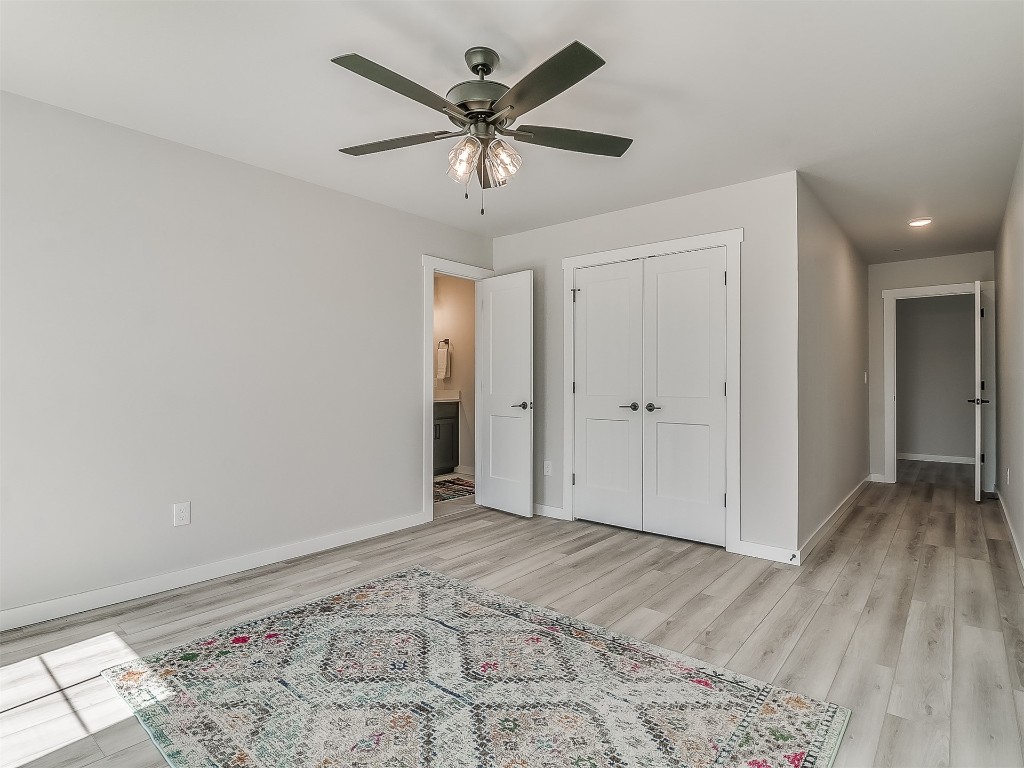 1735 NW 14th Street, #A&B, Oklahoma City, OK 73106 bedroom featuring a closet, light hardwood / wood-style floors, and ceiling fan