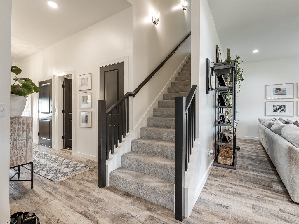 2300 El Cajon Street, Edmond, OK 73034 stairs featuring light hardwood / wood-style flooring