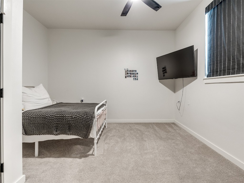 2300 El Cajon Street, Edmond, OK 73034 carpeted bedroom featuring ceiling fan