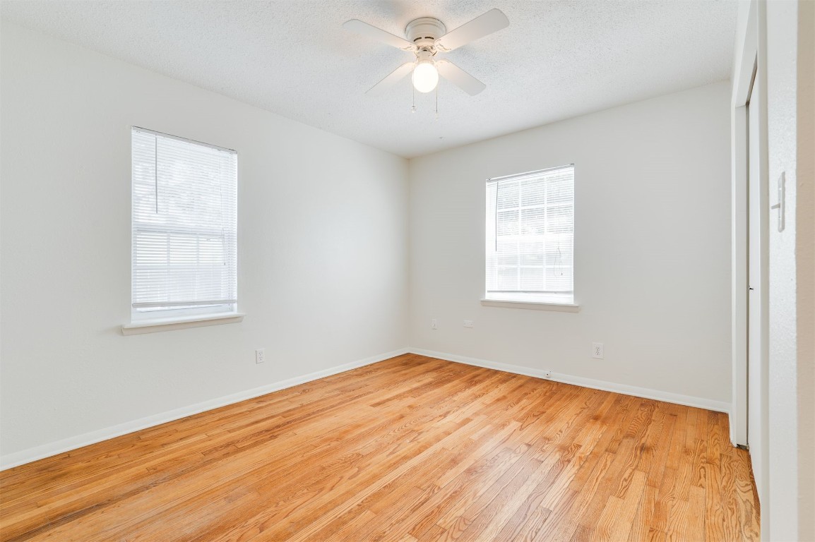 2616 NW 33rd Street, Oklahoma City, OK 73112 unfurnished room with light hardwood / wood-style flooring and ceiling fan