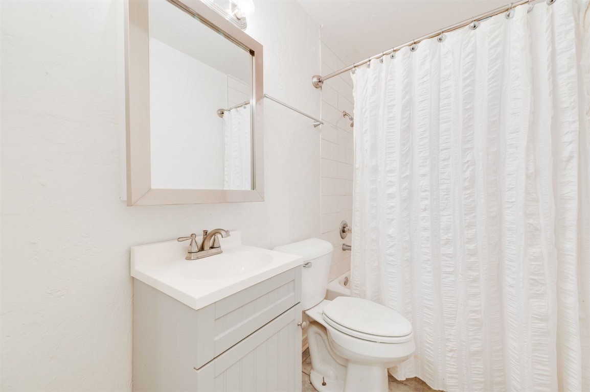 2616 NW 33rd Street, Oklahoma City, OK 73112 full bathroom with shower / bath combo, vanity, and toilet