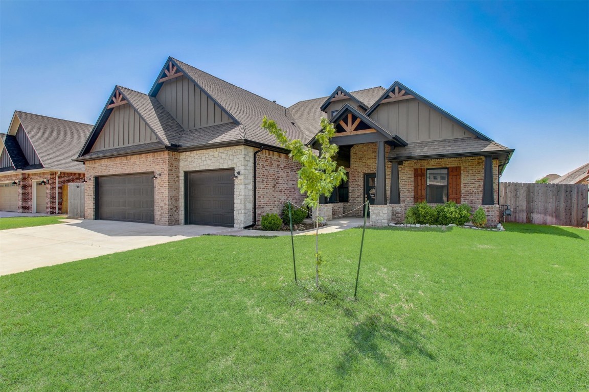 9224 NW 82nd Street, Yukon, OK 73099 craftsman-style home with a garage and a front yard